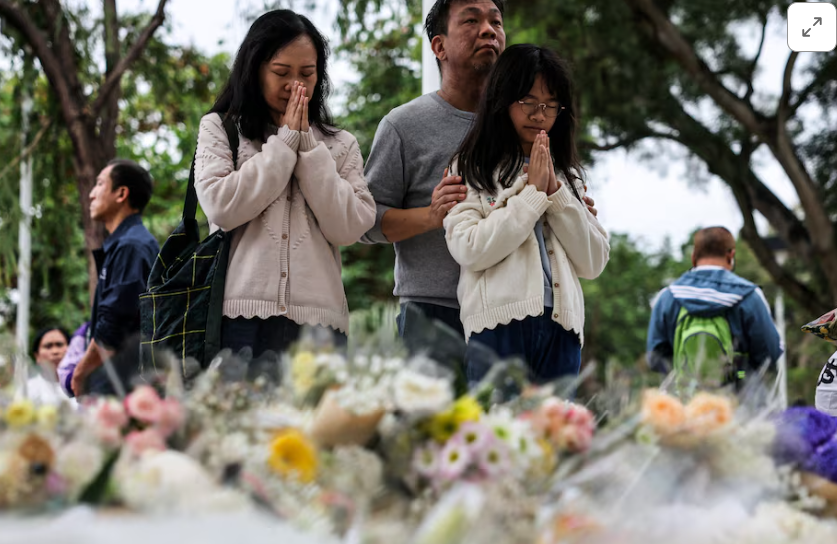 Mourners flock to site of deadly HK blaze