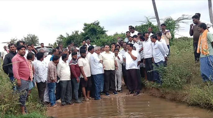 MLA B.N. Ravikumar Inspects Flooded Road and Addresses Public Grievances
