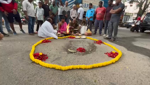 Bharathinagar residents stage pothole puja
