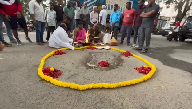 Bharathinagar residents stage pothole puja