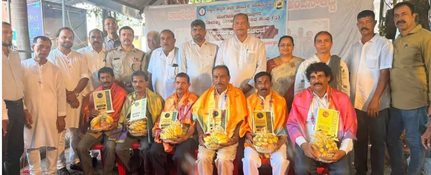 Honours achievers on Labour Day event in Mangaluru
