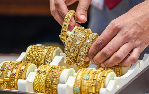 Gold, Silver fall as dollar gains strength